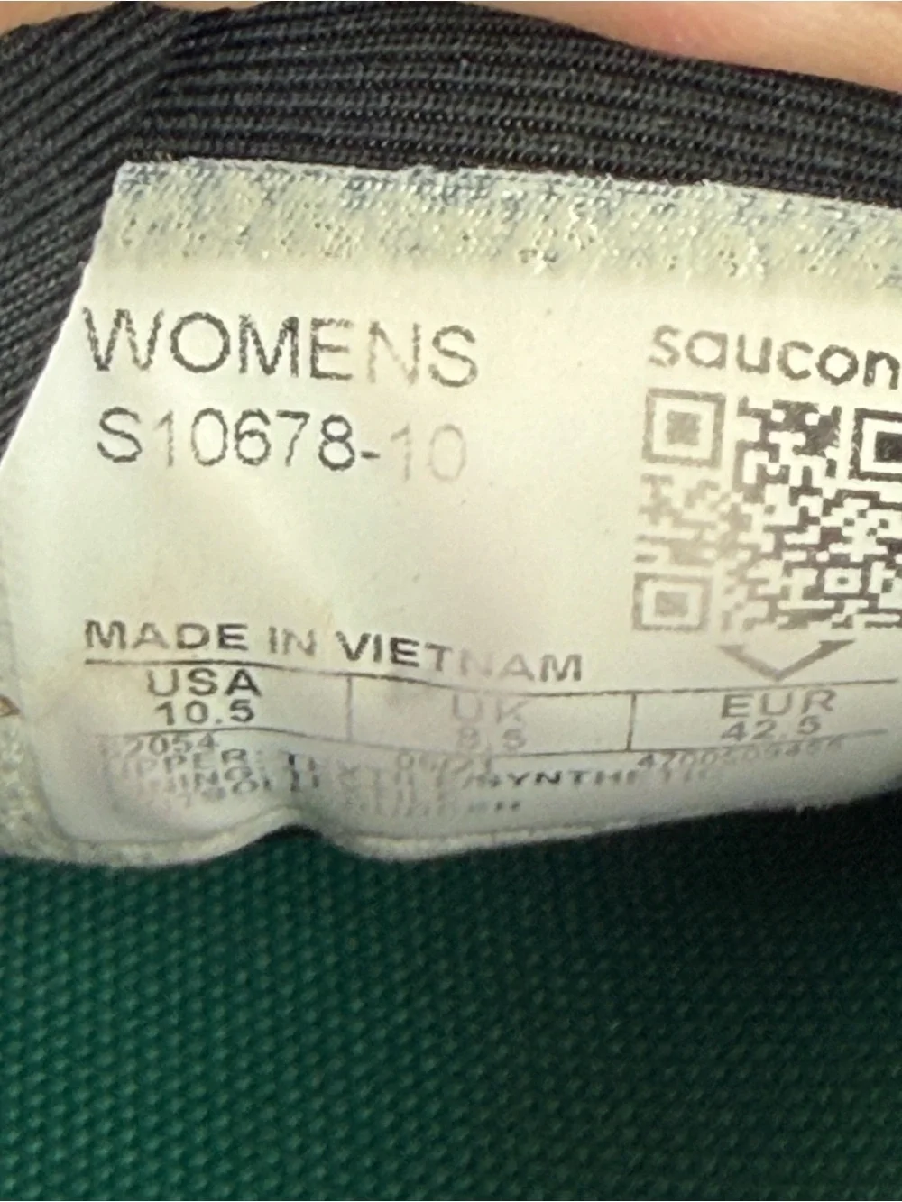 Saucony Triumph 19 running shoes in black an white with subtle teal accents 10.5